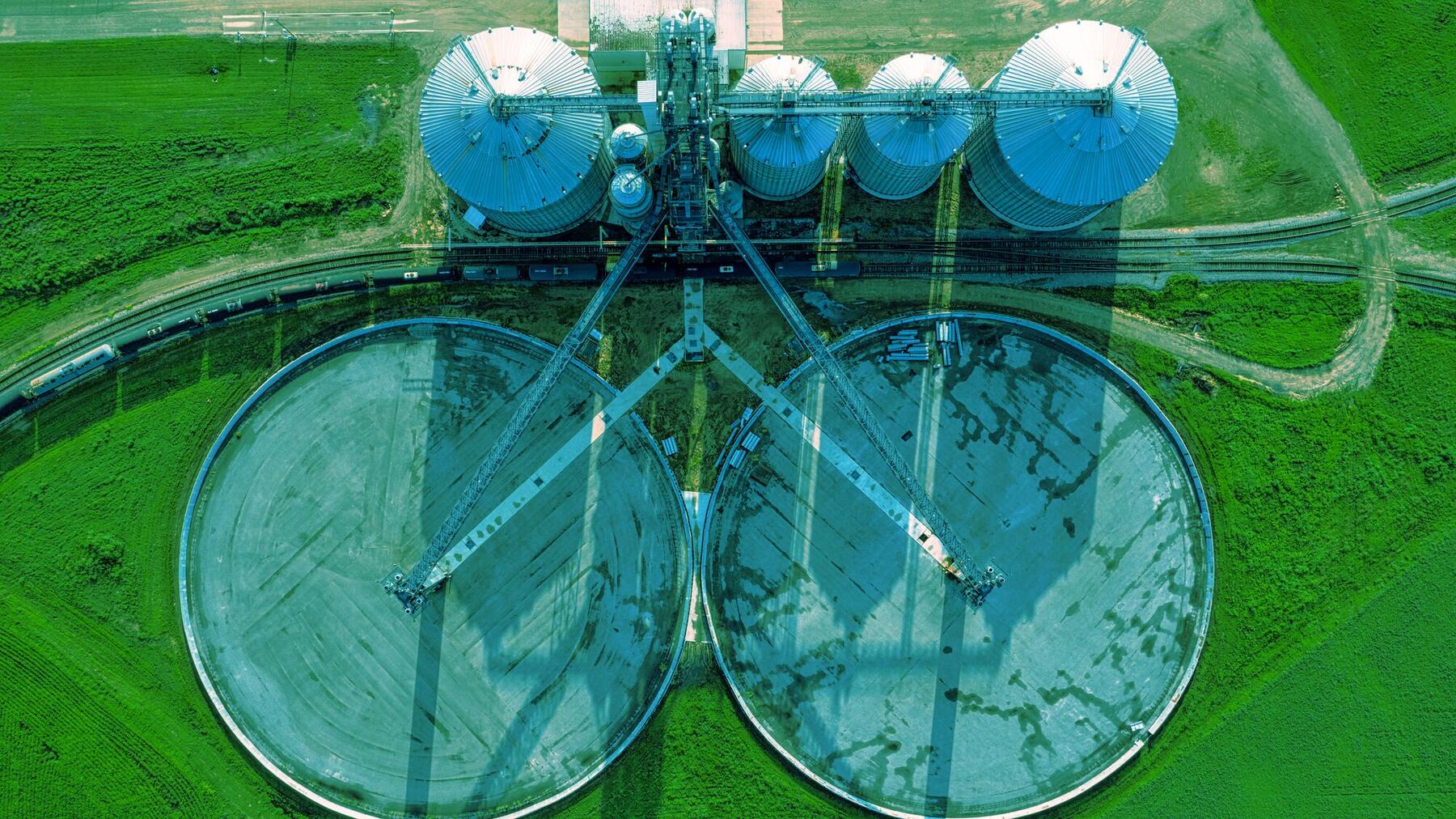 Aerial view of two circular clarifiers at a wastewater treatment plant